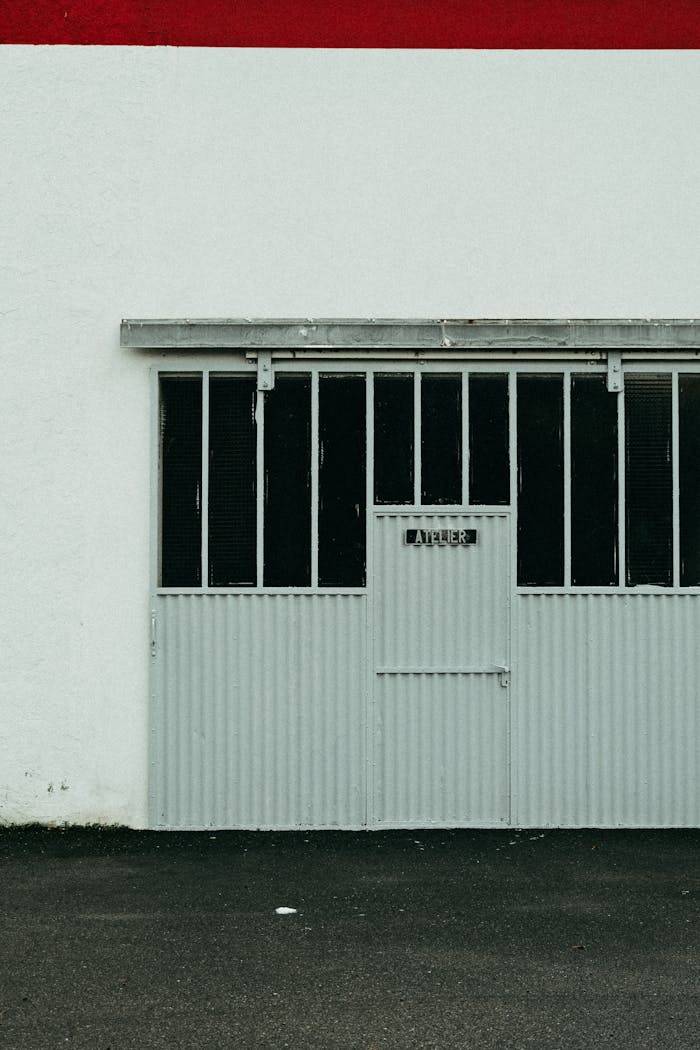 Vertical shot of a vintage metal garage door with a minimalist and industrial feel.