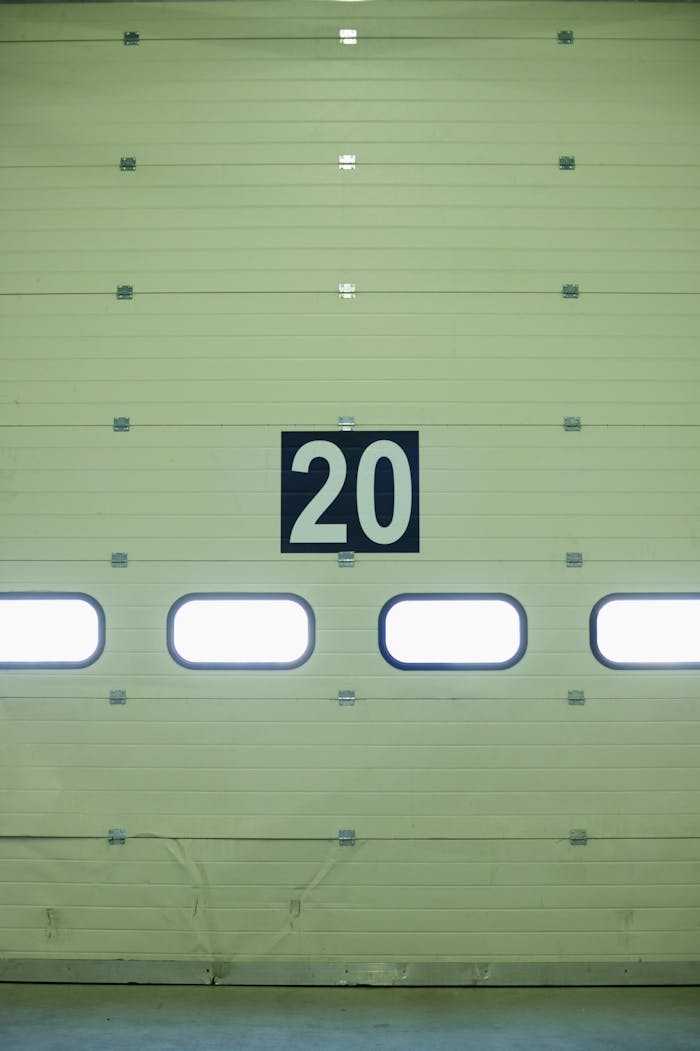 Close-up of a large industrial garage door marked with the number 20.