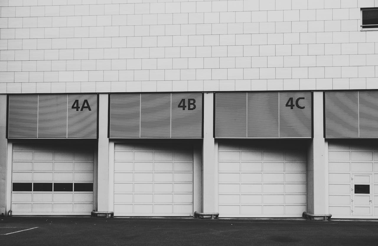 Monochrome image of three adjacent industrial loading docks labeled 4A, 4B, 4C.