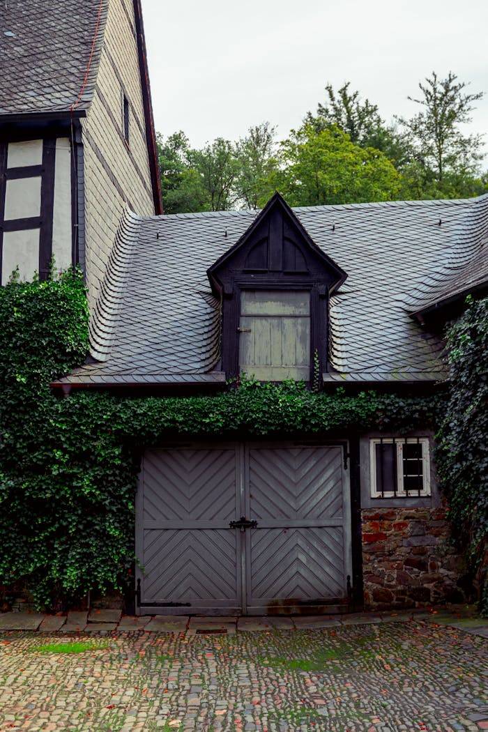 A quaint historic house with ivy-covered walls and unique architecture in Morsbach, Germany.