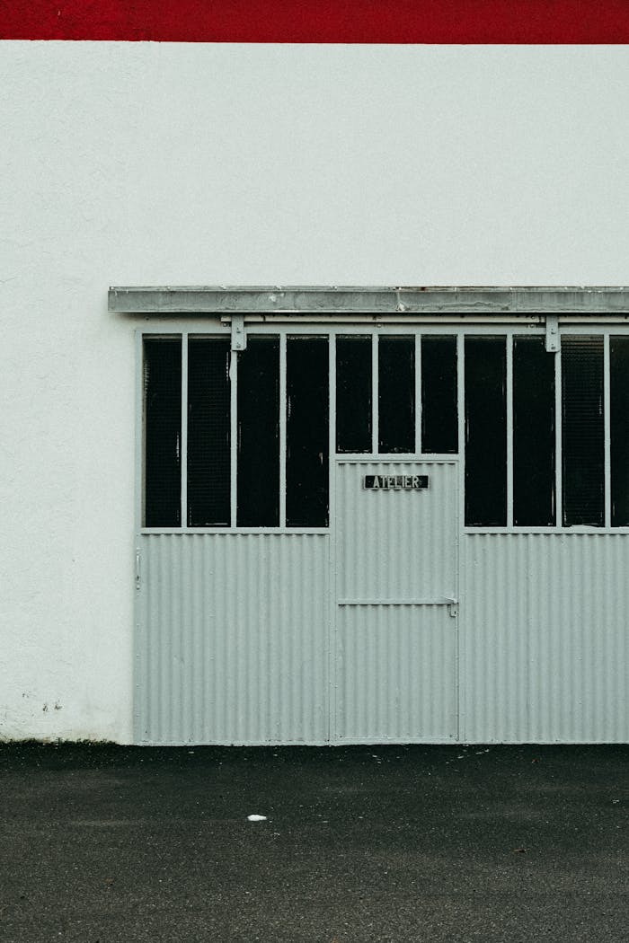 Vertical shot of a vintage metal garage door with a minimalist and industrial feel.